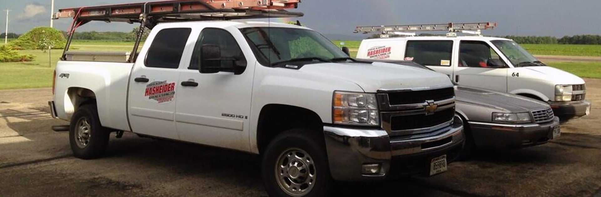 Hasheider Roofing and Siding work trucks